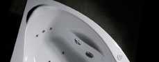 Detail of the bathtub Orava with visible arm support and headrest.